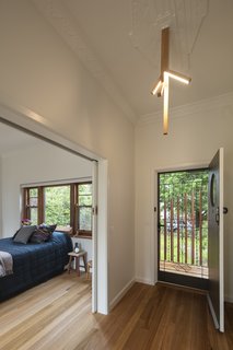Dunin wanted to carry the theme of the eucalyptus throughout the property, including in the entryway, which has a light resembling branches. 
