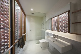 The custom towel rails in this bathroom are also meant to mimic branches. 