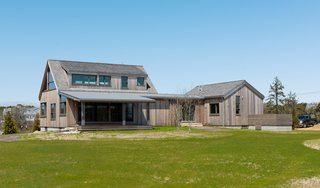 Western Red Cedar with a clear vertical grain was paired with vertical and horizontal shiplap for the exterior siding. 