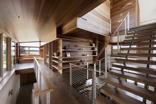 Thompson wanted to create "layered and veiled spaces" inside, which was achieved with multiple places to gather in the main corridor. The corridor is open from the second floor down to the basement, and has a combination of skylights and windows for ample light. Paradis MetalWorks supplied the rail and stair stringers. 