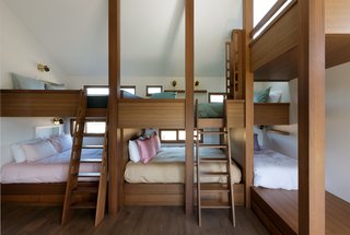 "The two queen bedrooms can handle two couples, while the bunk-bed room can handle all the kids," Thompson says. She also made sure every bunk had a window, to act as a "mini room."