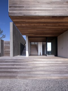 The oversized entry door and hardware are by Arcadia. 