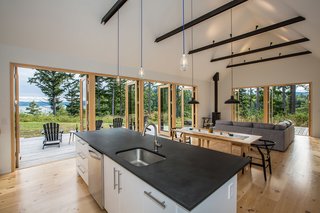 Clean, white, and warm interiors are punctuated by darker accents.