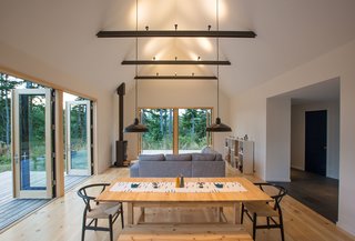 The great room extends out to decks on two sides, creating a cozy yet expansive space for comfortable, easy living.