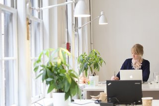 Similar to a gym membership, Oficio clients can purchase subscription access to workspaces ranging from comfy armchairs to communal work tables.