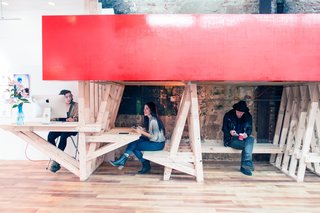 The Con Artist Collective accommodates both artist studio space and art storage with innovative structures.