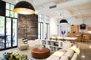 Designworks' office - formerly an art gallery in downtown Auckland - honors its past by keeping with an open floor plan and abundant natural light. 