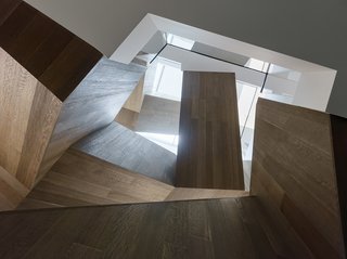 A Historic Victorian in San Francisco Is Meticulously Transformed Into a Modern Family Home - Photo 12 of 26 - The stairs' folded volumes juxtapose solid wood forms with light-filled voids.