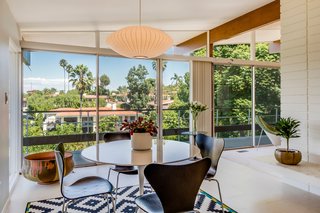 Adjacent to the kitchen is an eat-in dining space that's flooded with natural light.