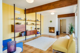 The cozy lower-level living space contains the home's second fireplace.