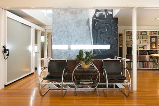 An Amazing Tree-Covered Glass House For Sale in the Berkeley Hills - Photo 13 of 20 - Though there are many parts of the home the family felt were special, they had a particular fondness for the original mural by artist Claire Falkenstein, which was prominently installed at the home's entrance.
