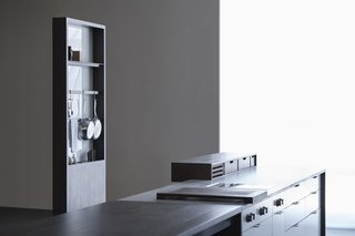 Storage options for the ‘working side’ include shelves, pot racks, integrated outlets, knife storage, and recessed areas for things like keys.