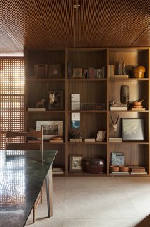 An Incredible Brazilian Home That Celebrates Art, Travel, and Nature - Photo 6 of 14 - Art, photographs, and sculpture are thoughtfully displayed throughout the home.