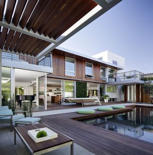This net-zero residence by CitiZen Design Studio features Western Window Systems chosen for energy efficiency. The Series 600 Multi-Slide 90-Degree Door is architecturally eye-catching, meeting at a right angle in the home’s great room, and features dual-paned low-E glass.