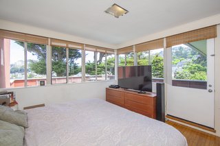 The master bedroom is connected to the home’s largest outdoor terrace, substantially increasing usable living space.