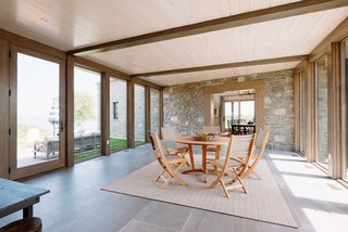 Flanked on both sides by Marvin windows and Marvin Swinging French Doors, the sunny bridge is flooded with light at all times of the day, and became one of the homeowners’ favorite and most regularly used parts of the home.