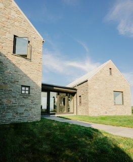 Marvin Ultimate Push Out Casements, and smaller fixed windows, are used at the front façade to add character and context to the home, referencing the traditional form of the Irish cottage. Heavy stone lintels can be seen above many of the home’s windows, also contributing to the traditional cottage vernacular.