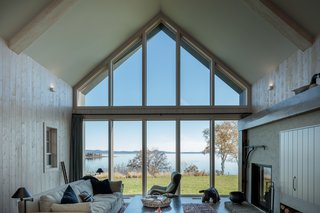 Adair and Kopp carefully studied each window opening in model form, testing the light quality and making adjustments as needed. At the rear façade, customized Marvin Special Shapes gave them the freedom to create the stunning showcase of symmetric gabled glass. The pair forewent a slick curtain wall in favor of multiple glass panes with visible mullions, to add coziness and maintain the scale and feel of a cottage.
