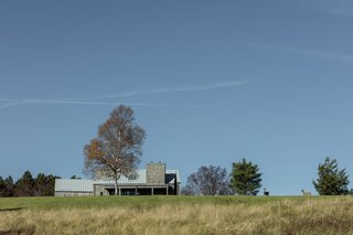 By foregoing additional landscaping, and rejecting unnecessary ornamentation, Jamie and Kathy wanted their home to appear, simply, as "a house on a hill in a field."