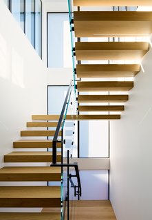 A new interior stair allows vertical circulation and funnels light into the interior space.