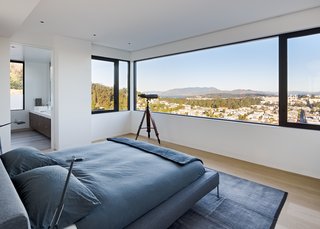 The master bedroom, on the home's top floor, offers panoramic views of the city, bay, and beyond.