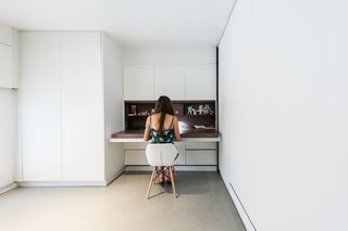 Many of the essential elements required for modern living are tucked into the walls: desks, tables, TVs, ironing boards, and more.