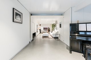 The design team made the most of the tricky, long and narrow space, allowing it to function as a studio, a one-bedroom, or a two-bedroom apartment—with no single configuration being permanent.