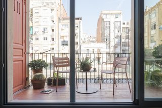 The view from the kitchen to the newly opened terrace is one of Serboli's favorite parts of the home. "I love being in the kitchen, looking at the living room with the big window totally open. I think it's a privileged position because you can cook or eat (I love both) looking towards a space with unclear and undefined limits."