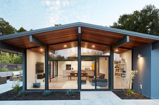 Fresh, bright, and cheery, the updated architecturally significant residence complements the couple’s modern lifestyle.
