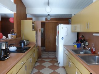 The dated galley kitchen was originally positioned in the middle of the home, sandwiched between the dining room and living room on either side—yet lacking connection to either.