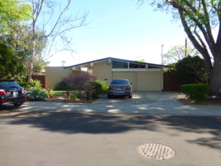 The home’s post-and-beam construction and pitched roof typify Eichler’s work.