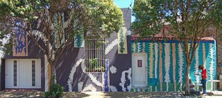 Marino Santa Maria covered Pasaje Lanín with Venetian mosaics and tile murals with a team of 20 neighborhood volunteers. 