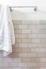 Modern home with Marble Counter, Medium Hardwood Floor, Pedestal Sink, Enclosed Shower, Two Piece Toilet, Bath Room, Ceramic Tile Wall, and Alcove Tub. Guest Photo 2 of 7th Avenue