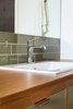 Modern home with Wood Counter, Medium Hardwood Floor, Recessed Lighting, Ceiling Lighting, Enclosed Shower, Wall Lighting, Alcove Tub, Ceramic Tile Wall, Drop In Sink, Two Piece Toilet, and Bath Room. Guest Photo 6 of South Land Park