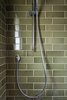 Modern home with Medium Hardwood Floor, Wood Counter, Enclosed Shower, Ceiling Lighting, Recessed Lighting, Wall Lighting, Ceramic Tile Wall, Drop In Sink, Alcove Tub, Two Piece Toilet, and Bath Room. Guest Photo 7 of South Land Park