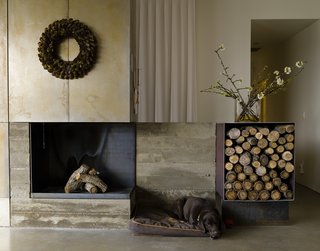 At a contemporary farmhouse in a canyon in Utah, the site is adjacent to the Park City ski resort with ski-in access, and texture and natural materials are found throughout the project. For example, the living room fireplace extends outdoors with a board-formed concrete bench.