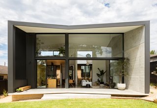 Wall, roof, and floor planes extend the envelope at the rear to form a covered terrace, which also improves privacy from adjacent neighbors and strengthens connection to the home's external environment.