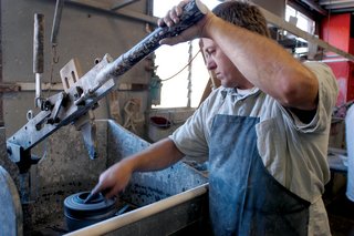 This process is called manual jiggering. An inner profile of a form is pulled down and spreads the clay into a rotating plaster form. Water is sponged on to each piece to smooth the surface. Our automated jigger machines make bowls by spreading clay into a spinning plaster mold.