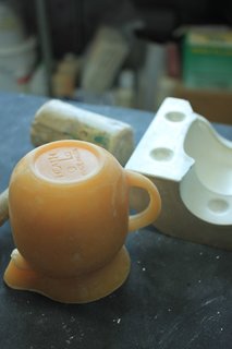 Using a wax cast to craft the custom molds.