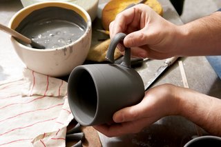 Each handle is slipcast and the cups are jiggered separately. The cup handle is then applied by hand.