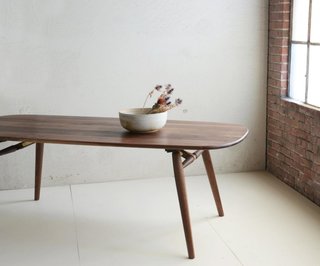 Made with constantly moving city dwellers in mind, Dave developed the Nomad table (shown here in Natural Walnut) which conveniently packs down for easy travel. 