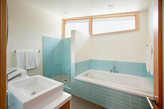 Modwalls Lush 3x6 glass subway tile in Vapor pale blue.