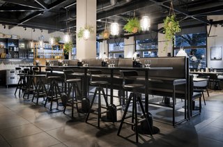Guests Enjoy Meal Under Modern Restaurant Pendant Lighting in Sweden - Photo 2 of 3 -