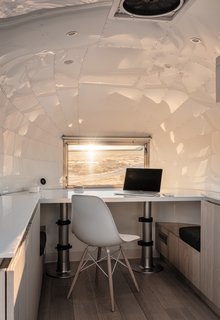 Edmonds designed a desk set on pistons that converts to a bed.