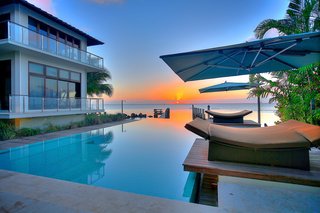 Coastal Contemporary:
10 Modern Seaside Homes - Photo 5 of 10 - Private Oceanfront Vistas: Designed by Deborah DeLeon of Village Architects, this example of modern island fusion is an exclusively private estate. Showcasing magnificent downtown Miami views, escape to this inspiring contemporary waterfront home. Presented by ONE Sotheby's International Realty.