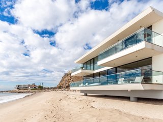 Coastal Contemporary:
10 Modern Seaside Homes - Photo 7 of 10 - Rebuilt, Redesigned, Reimagined: An architectural jewel on one of Malibu's premier beaches, this coastal contemporary home enjoys panoramic vistas of the Pacific. Masterful design and state-of-the-art technology make for truly modern coastal living. Presented by Sotheby’s International Realty – Sunset Strip Brokerage.