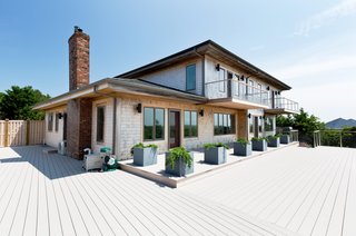Coastal Contemporary:
10 Modern Seaside Homes - Photo 6 of 10 - Provincetown Contemporary with Mid-Century Flair: Designed by Trevor Pontbriand, this Provincetown contemporary is a rare retreat with state-of-the-art amenities. Grand views of Cape Cod Bay and Wood End Light, and a screening room are among this captivating home's offerings. Presented by Atlantic Bay Sotheby's International Realty.