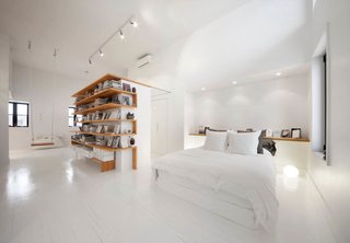 The architecture firm L. McComber Itée demolished a sloping ceiling in this Montreal attic to create a bright, roomy live-work space.