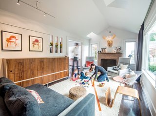 The Imhoffs vaulted the ceiling in their living room, dispensing with the old attic and carving out skylights to draw natural light into the space.
