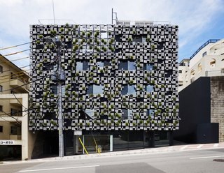 Irrigation and ventilation systems have been installed behind the panels so that the facade can accommodate the building's comprehensive system.
